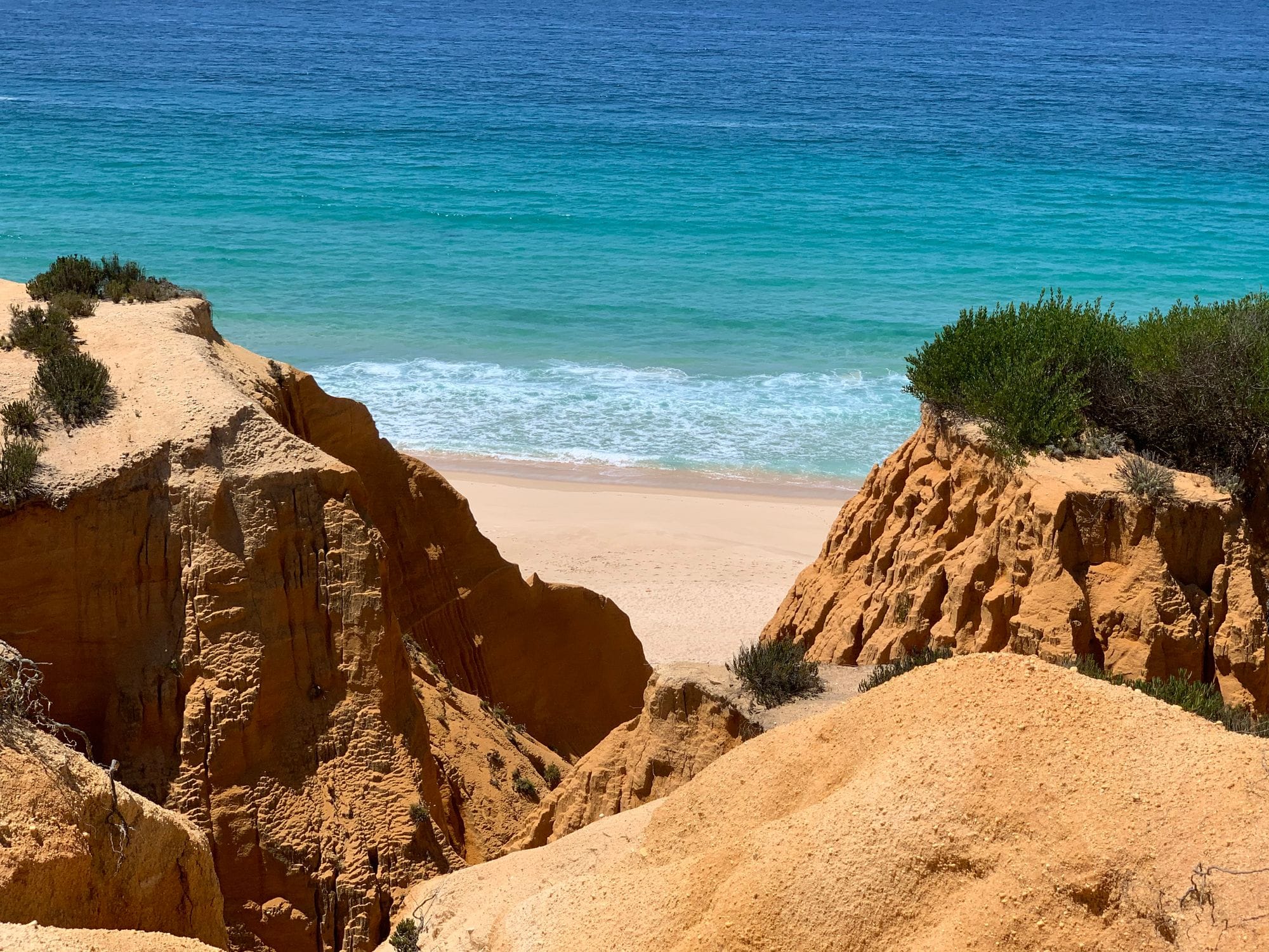 Ochre cliffs and turquoise sea on the Alentejo coast