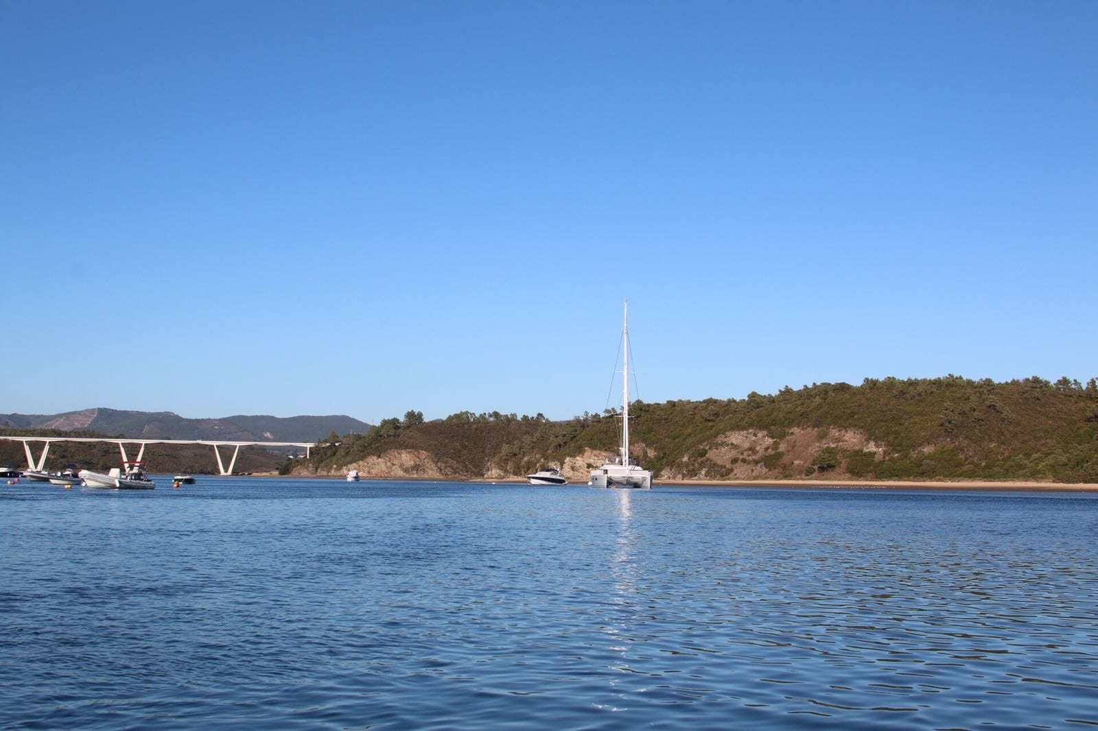 Catamaran anchored on the Mira near the bridge